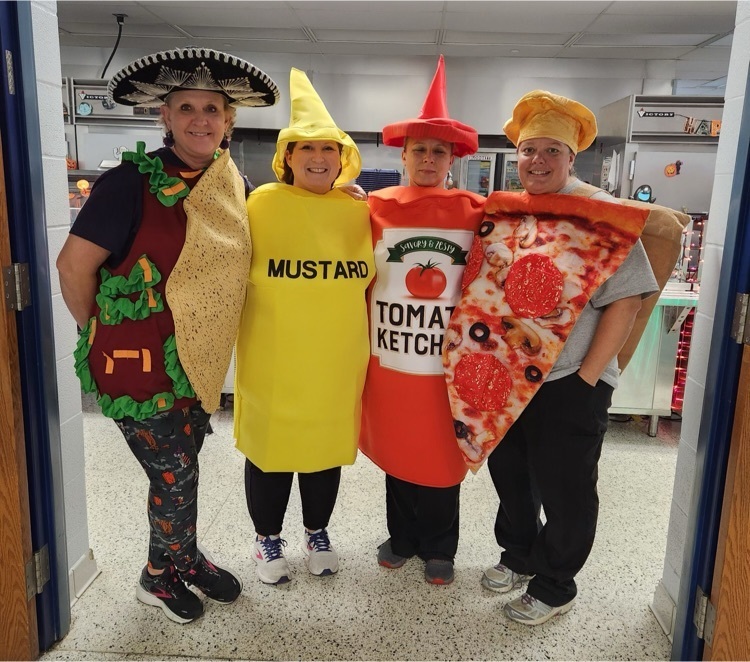 Elementary lunch ladies dressed up in Halloween costumes