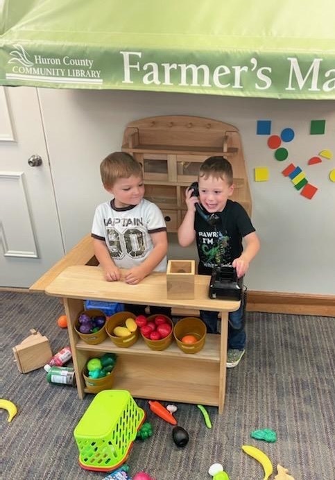 Two preschool students at the farmer’s market