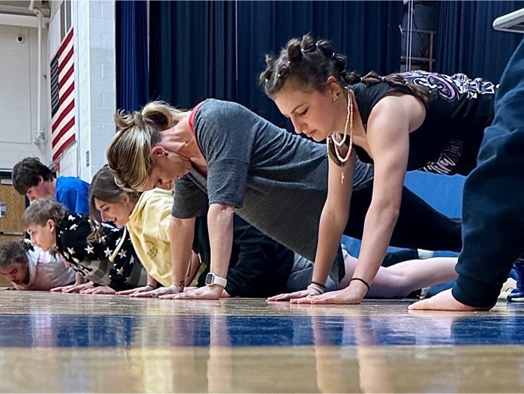 Students in high school conducting experiments in the gym.