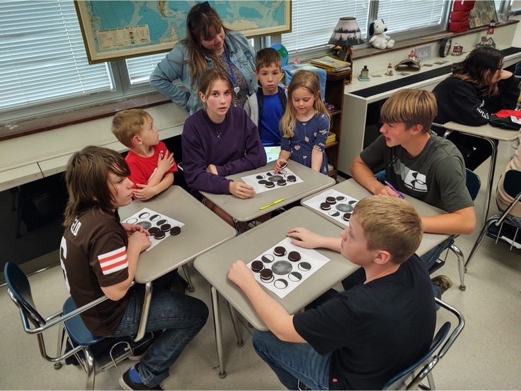 Seventh graders working with kindergartners.